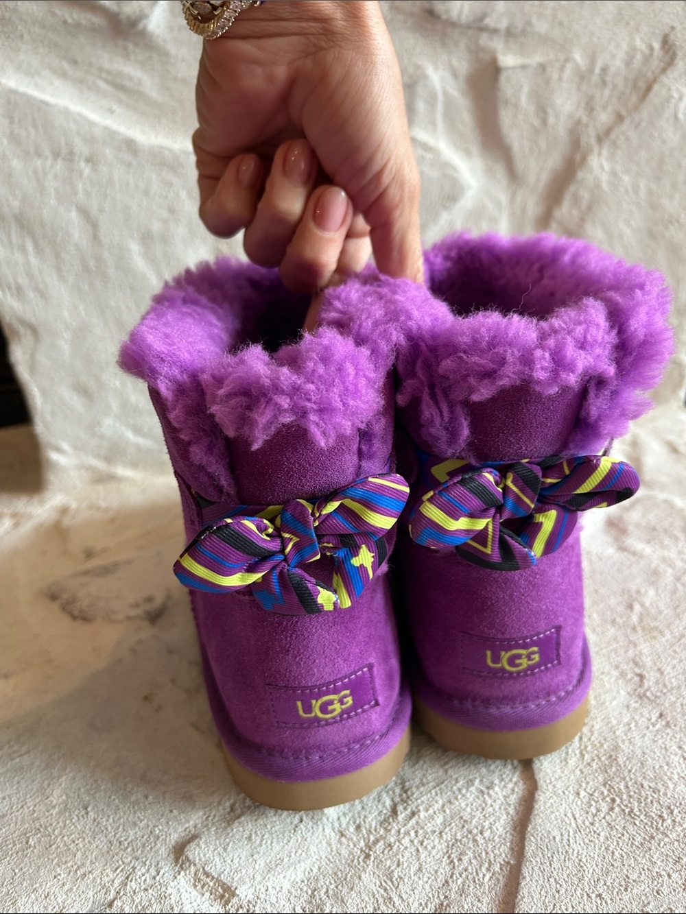 UGG Kids Vibrant Purple Shearling Boots with Multicolor Bow